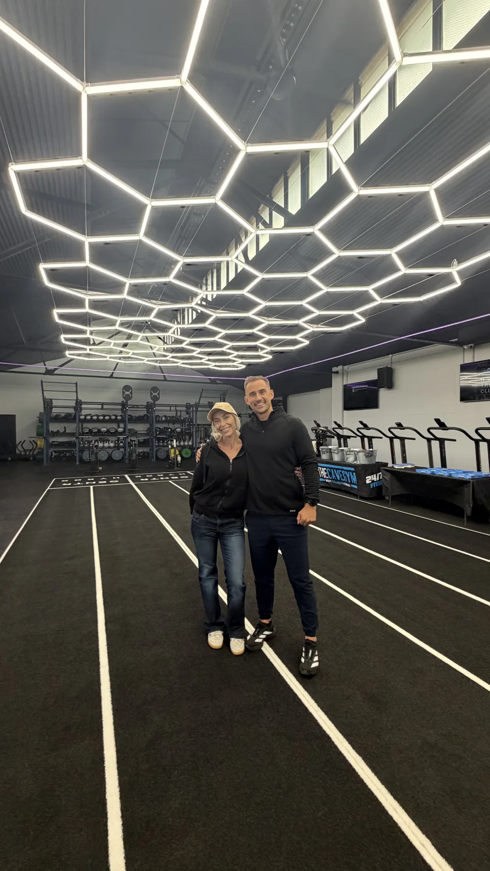 Jay Clark with a member of The Cave Gym team at the opening