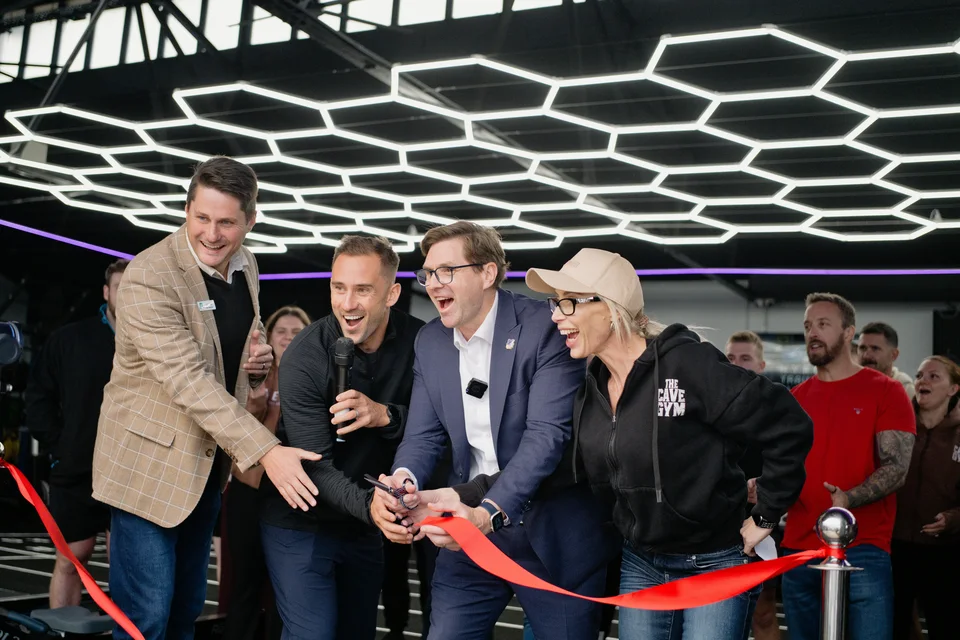 Jay Clark joining the ribbon-cutting at The Cave Gym HTCx opening