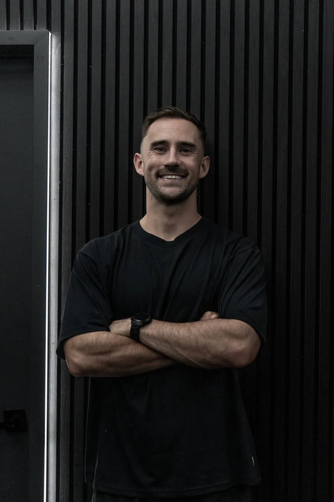 Jay Clark smiling in a gym