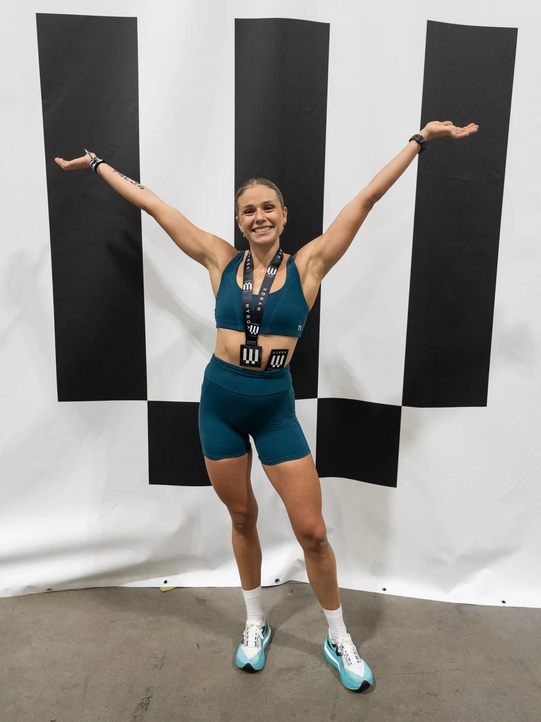 Lovisa Clark celebrating with her medal after her first solo HYROX World Championship